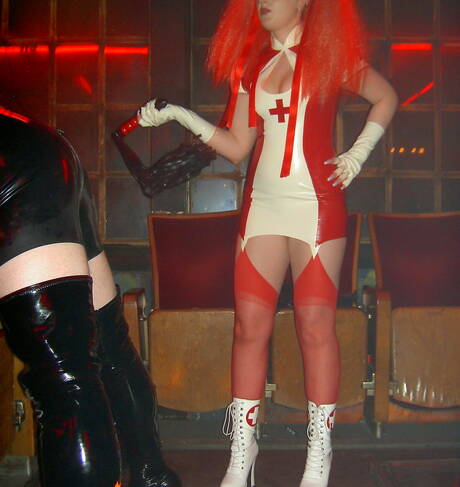 Rubber Tits are proud to present you with a free pictures featuring sexy miss in femdom play